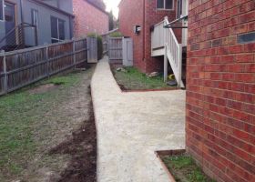 AFTER - With the new path installed, access to the house and back yard is improved.