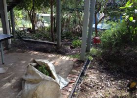 BEFORE - The area under the stairs was not easily accessed or attractive.