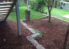 AFTER - With the new garden bed and plenty of mulch the area is greatly improved.