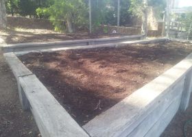 AFTER - Simple spreading of garden soil has left the beds ready for planting vegetables.